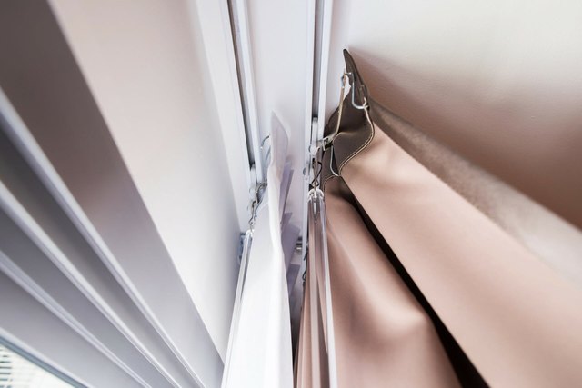 How to Clean a Ceiling Curtain Track