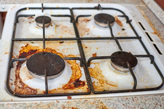 How to clean a gas stove burner of burnt residue