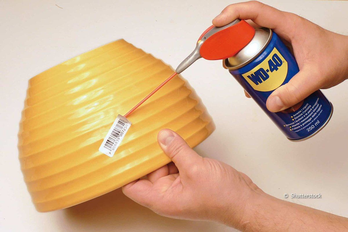Apply WD-40 to stubborn adhesive