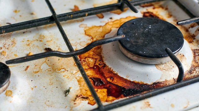 How to remove baked-on grease from a gas stove